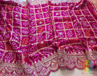 Close up of rani pink bandhani gaji silk dupatta highlighting gota patti work