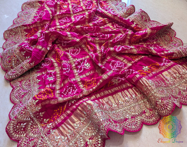 Rani pink bandhani gaji silk dupatta drape showing scalloped gota patti edge