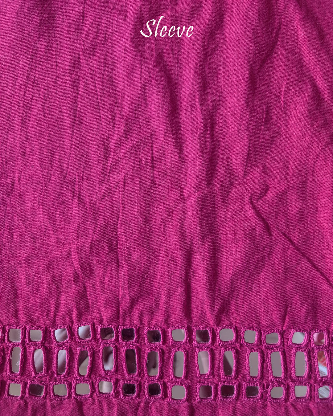Sleeve detail of the Pink Kala Cotton Kutch Mirror Handwork blouse piece, highlighting the real mirror embellishments, intricate threadwork and pink Kala Cotton fabric.
