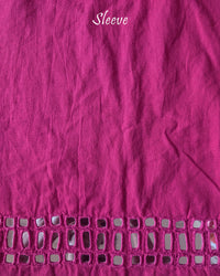 Sleeve detail of the Pink Kala Cotton Kutch Mirror Handwork blouse piece, highlighting the real mirror embellishments, intricate threadwork and pink Kala Cotton fabric.