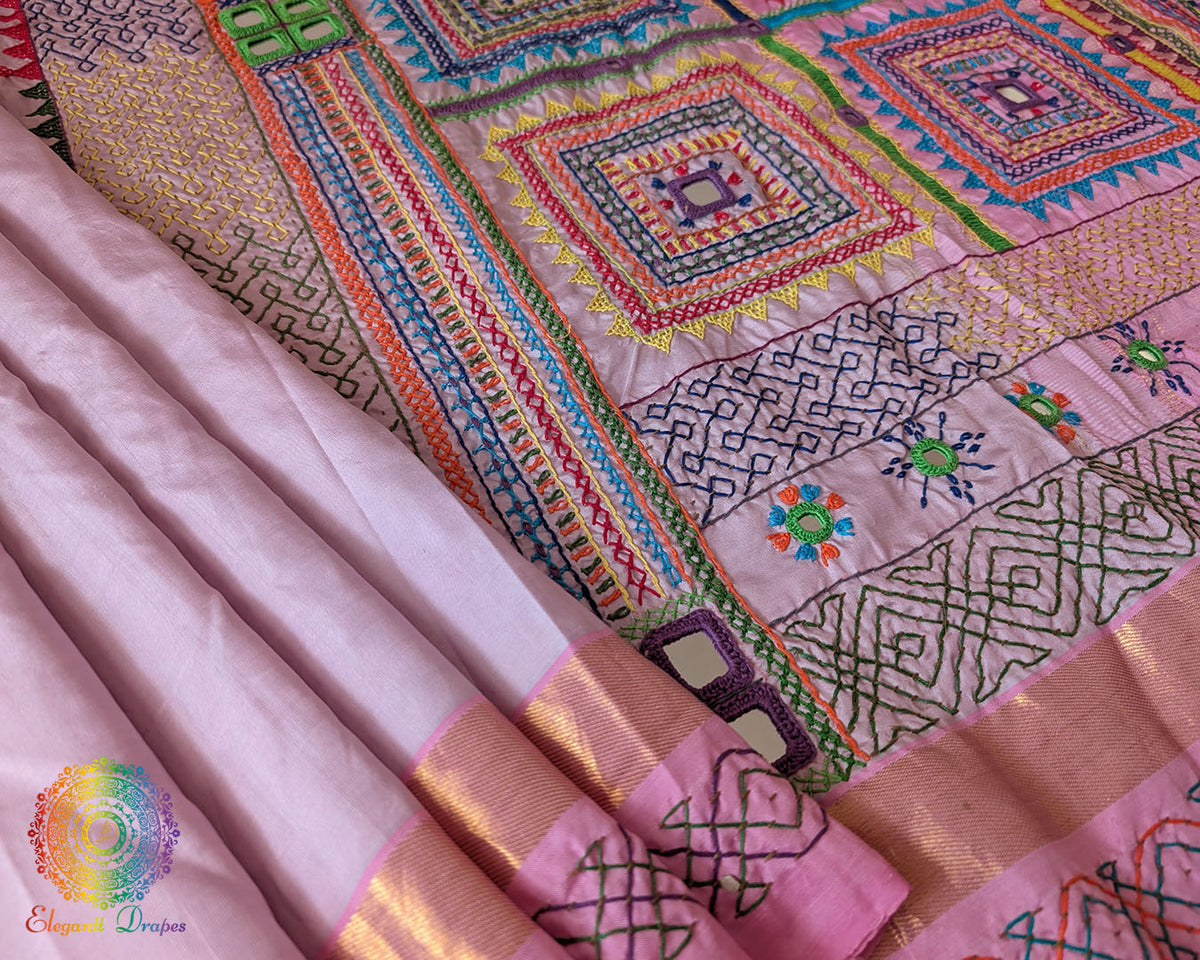 Pastel Pink Kanjivaram Silk Saree showcasing the silk body and Sindhur Lambani embroidery, highlighting the combination of traditional weaving and folk-art craftsmanship.