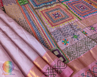 Pastel Pink Kanjivaram Silk Saree showcasing the silk body and Sindhur Lambani embroidery, highlighting the combination of traditional weaving and folk-art craftsmanship.