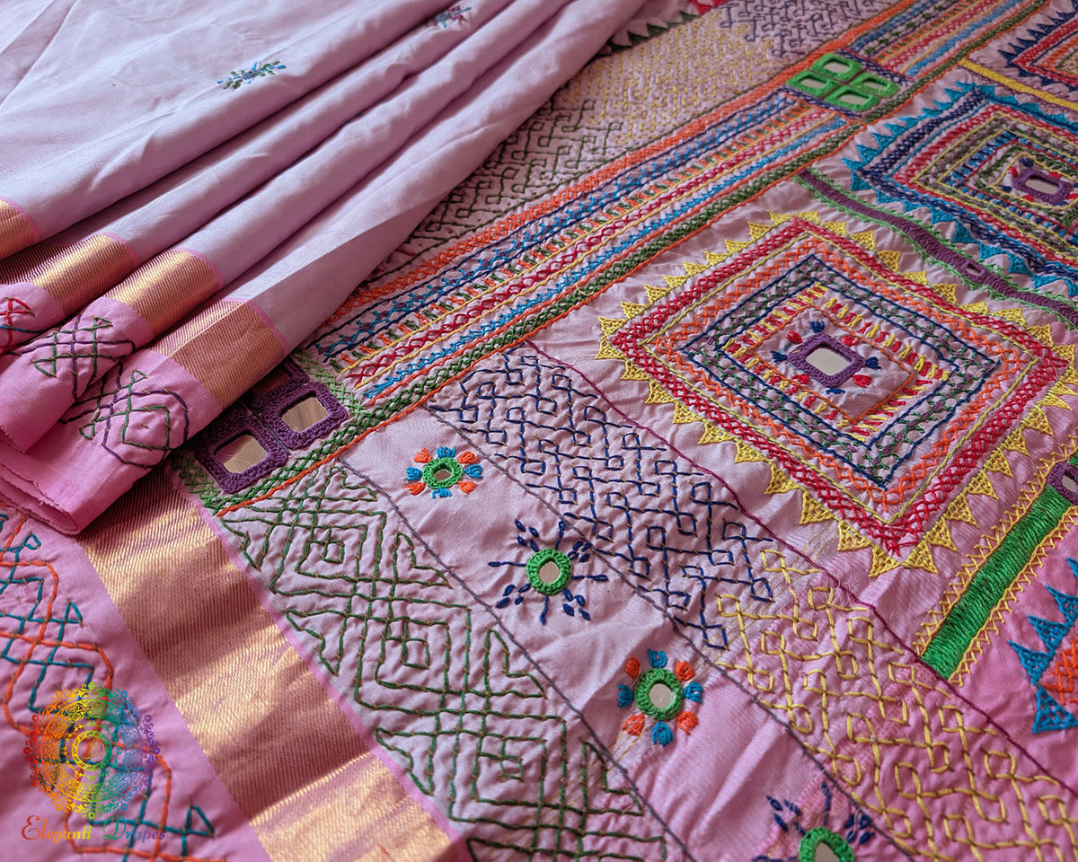 Detailed view of the Pastel Pink Kanjivaram Silk Saree highlighting the traditional Sindhur Lambani handwork and its colourful handcrafted patterns.
