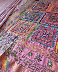 Pastel Pink Kanjivaram Silk Saree with Sindhur Lambani Handwork displayed in a full-length view, showcasing the elegant silk drape and distinctive handcrafted detailing.