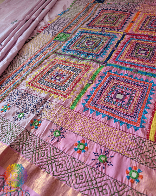Pastel Pink Kanjivaram Silk Saree with Sindhur Lambani Handwork displayed in a full-length view, showcasing the elegant silk drape and distinctive handcrafted detailing.