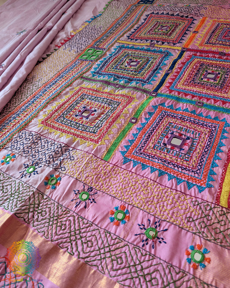 Pastel Pink Kanjivaram Silk Saree with Sindhur Lambani Handwork displayed in a full-length view, showcasing the elegant silk drape and distinctive handcrafted detailing.
