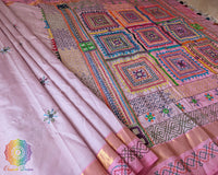 Pastel Pink Kanjivaram Silk Saree with Sindhur Lambani Handwork displayed to highlight the interplay of pastel pink silk and colourful handcrafted embroidery.