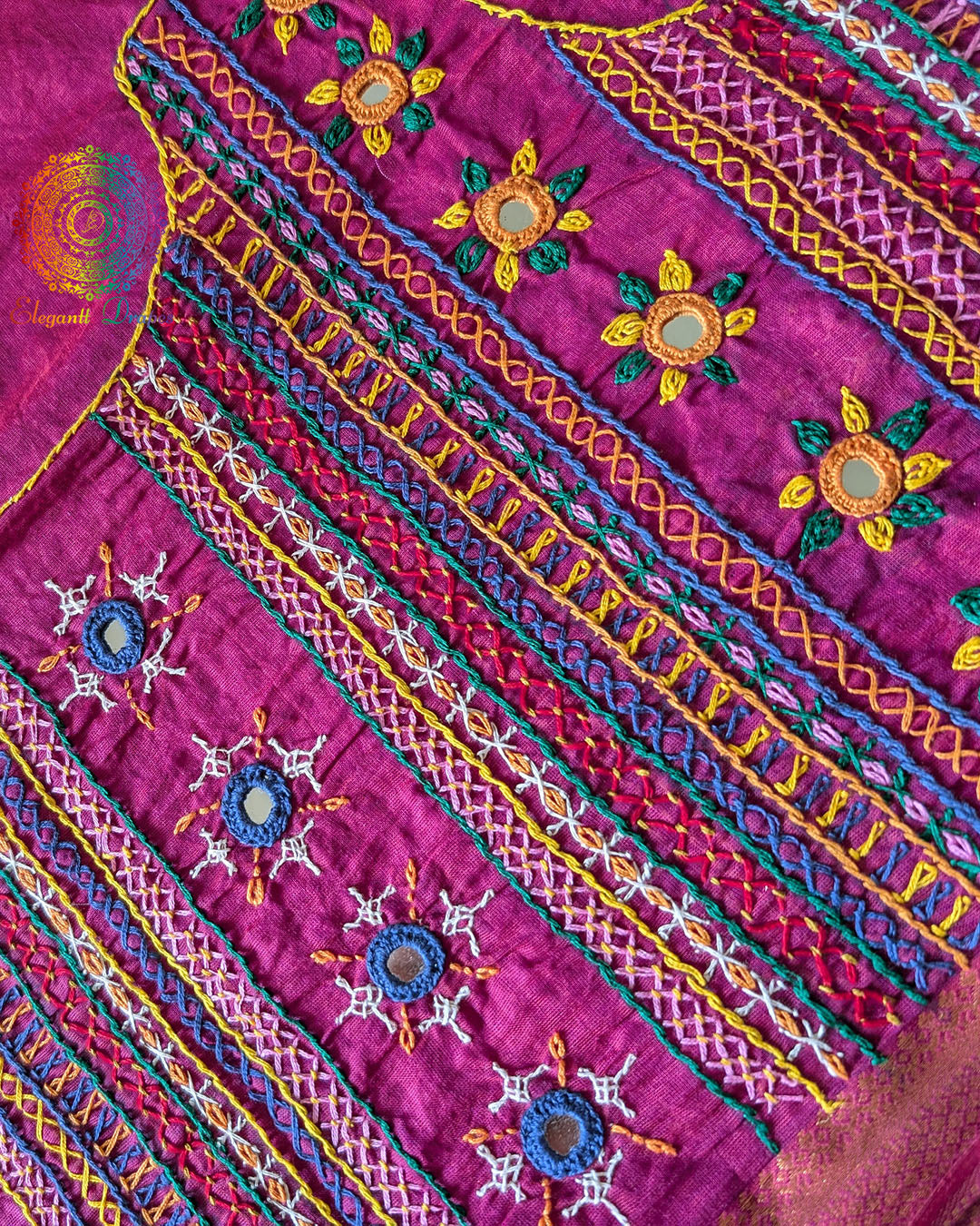 Close-up of Lambani hand embroidery on the back of Magenta Mangalgiri Cotton Blouse Piece