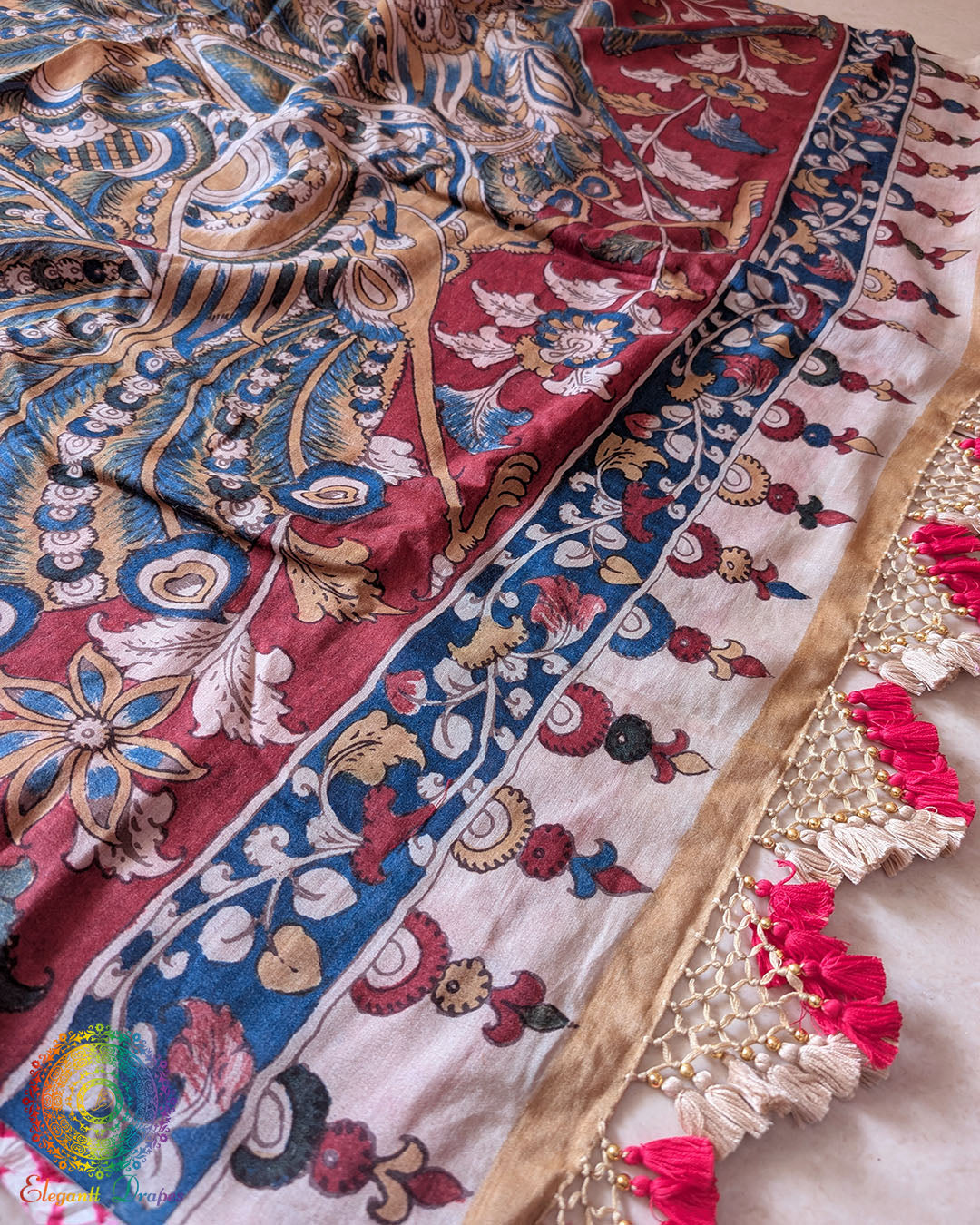 Close-up of the handcrafted heavy tassels adorning the pallu of the Pink Bandhani Kalamkari Muga Silk Saree