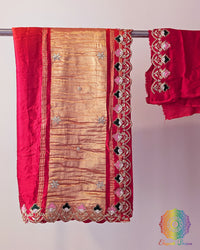 Pink orange ombre gaji silk saree folded showing hand embroidery