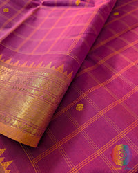 Pink Kanchi cotton saree close up highlighting checkered pattern and fabric texture