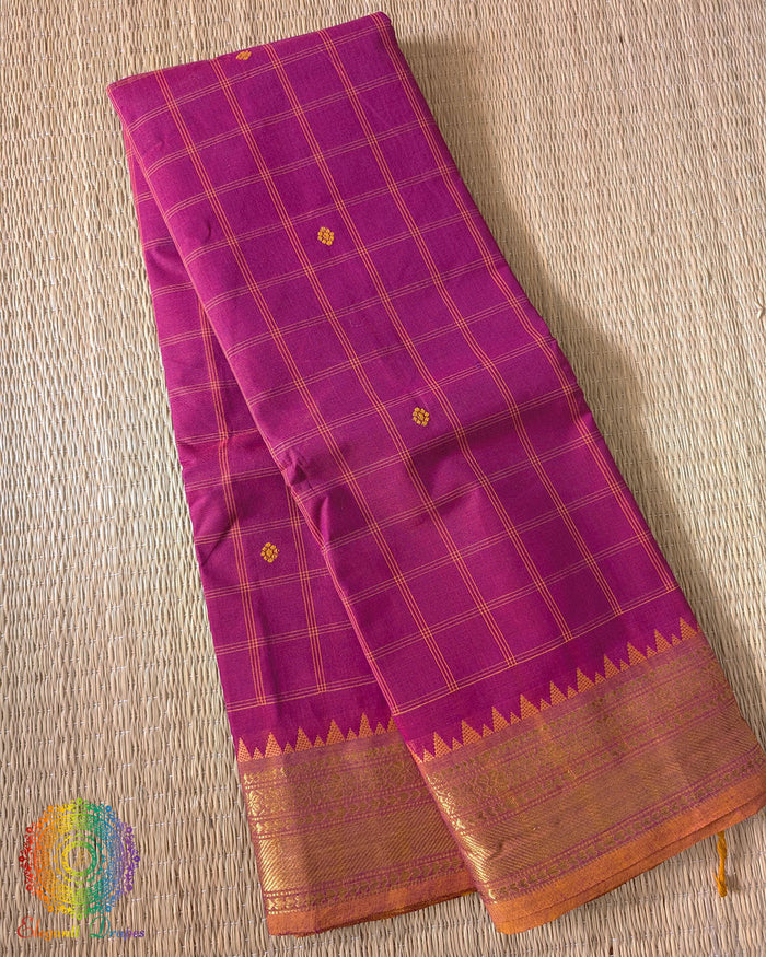 Folded pink pure Kanchi cotton checkered saree showing woven checks pattern