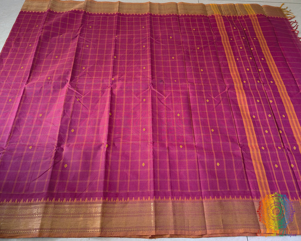 Full pink Kanchi cotton checkered saree laid open showcasing overall design and drape