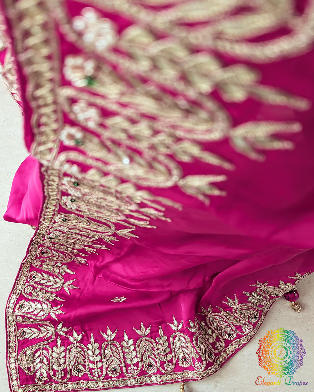 Close-up of Gota Patti and Sequin Handwork on Rani Pink Satin Crepe Saree pallu