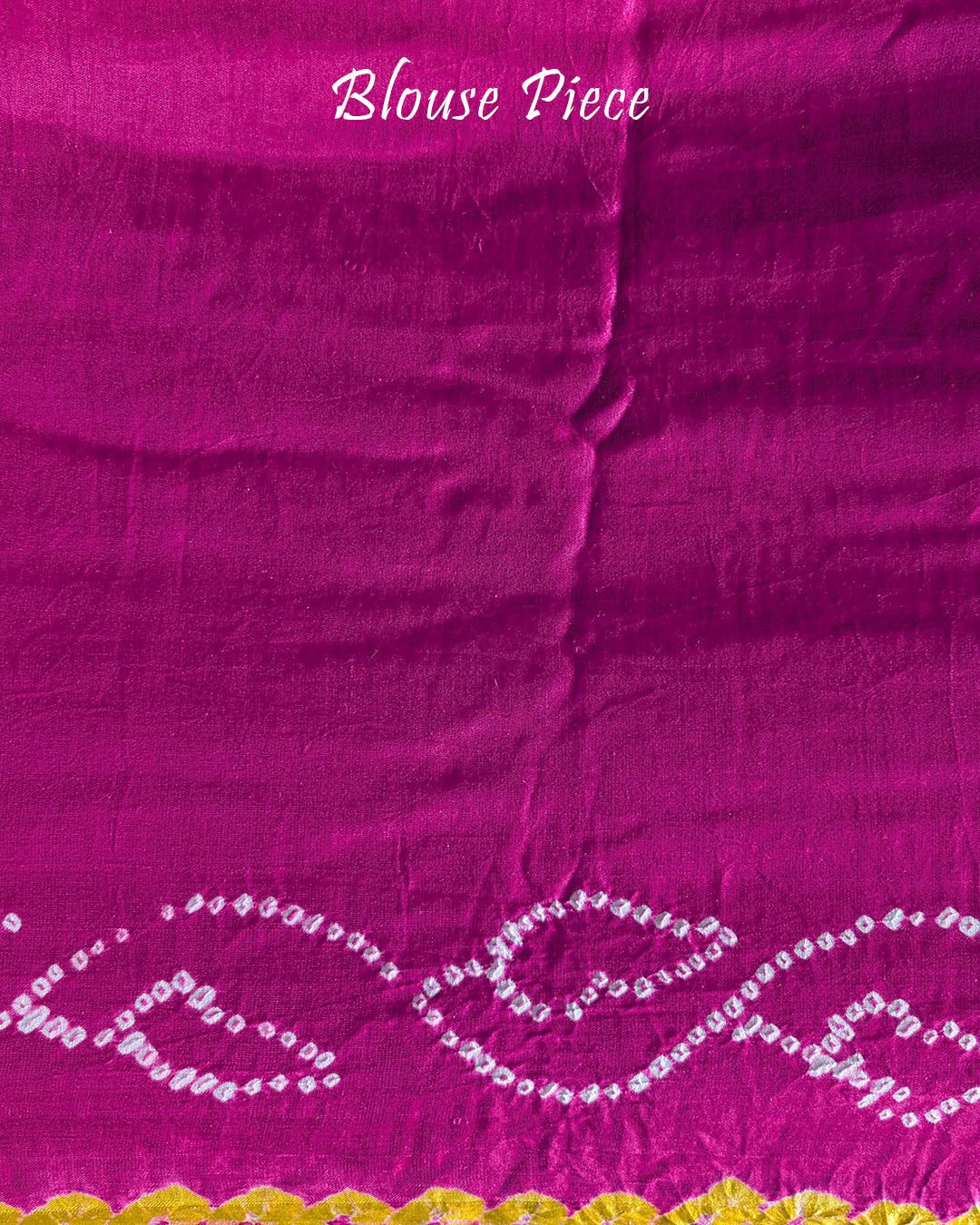Matching blouse piece in pink shaded gaji silk fabric with bandhani detailing
