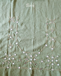 Back view of the Pista Green Kala Cotton Kutch Mirror Handwork blouse piece, showcasing detailed traditional embroidery and real mirrors arranged in a decorative handcrafted design.