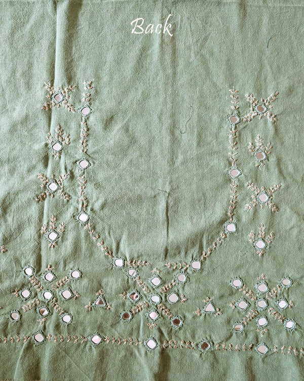 Back view of the Pista Green Kala Cotton Kutch Mirror Handwork blouse piece, showcasing detailed traditional embroidery and real mirrors arranged in a decorative handcrafted design.