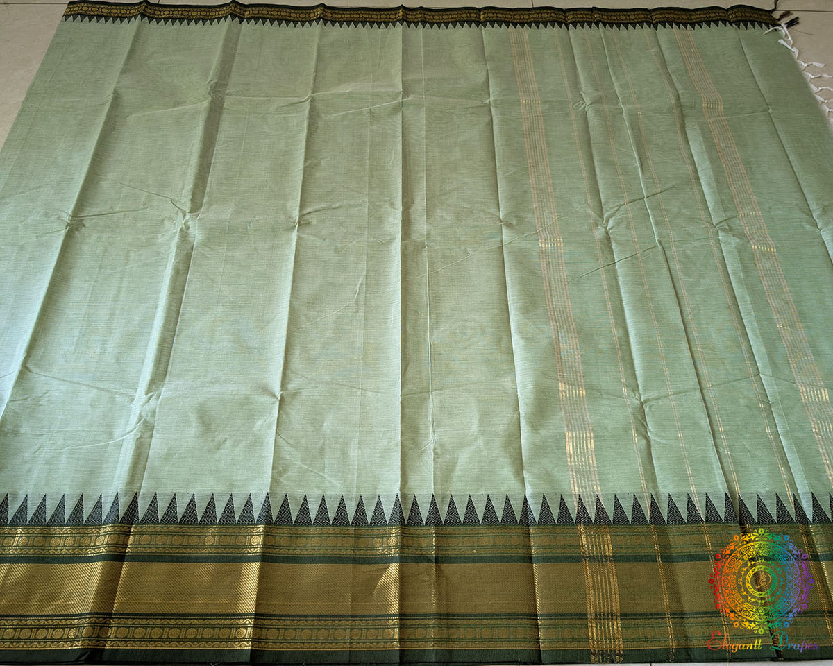 Full mint green Kanchi cotton saree laid open showcasing overall design and drape