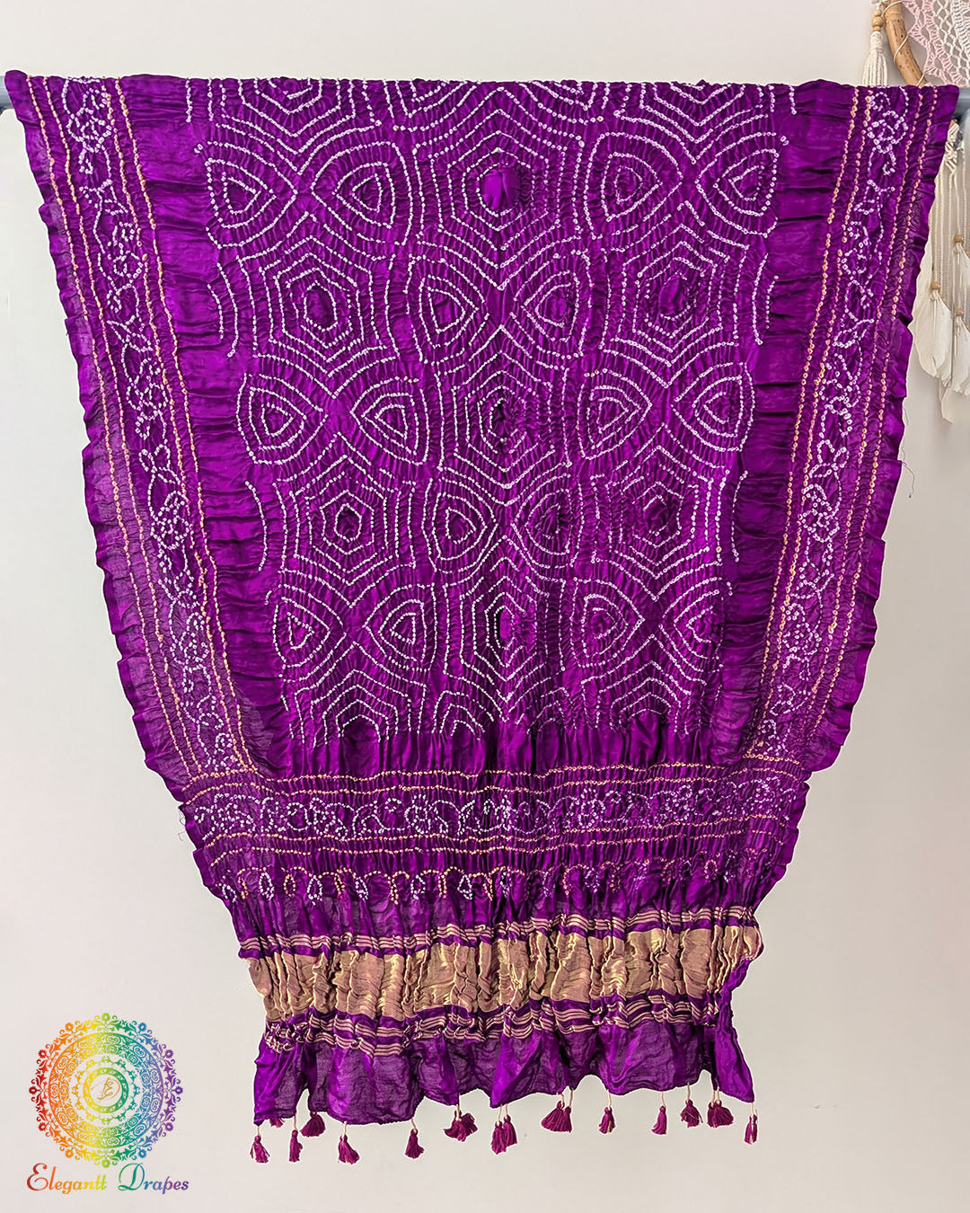 Close up of plum purple bandhani gaji silk dupatta showing tie dye detail