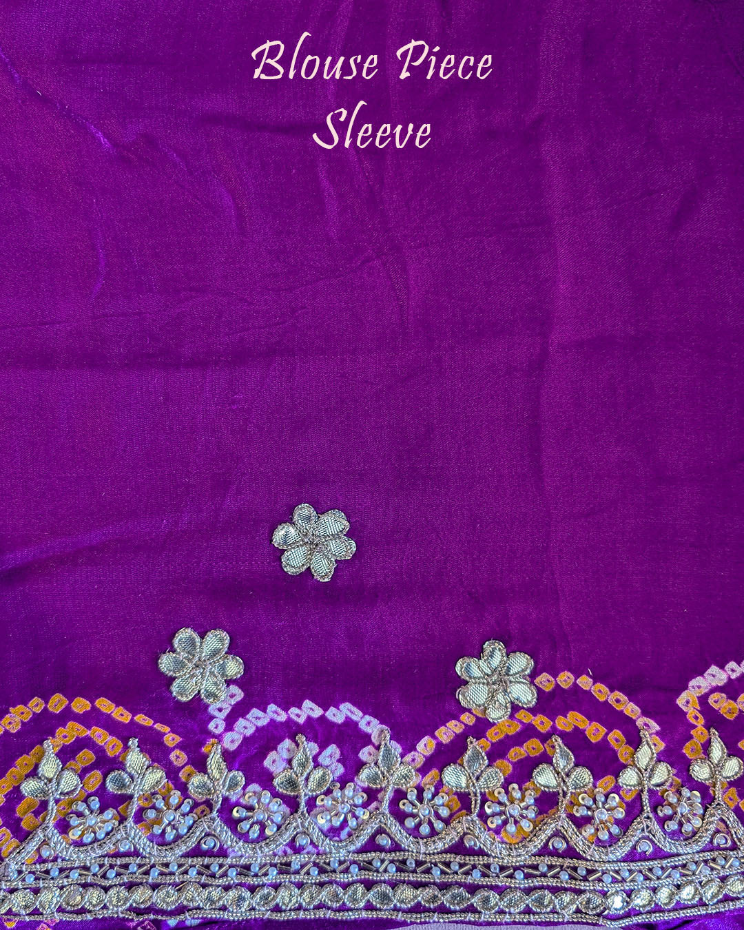 Matching blouse sleeve showcasing coordinated gota patti work and fabric detailing