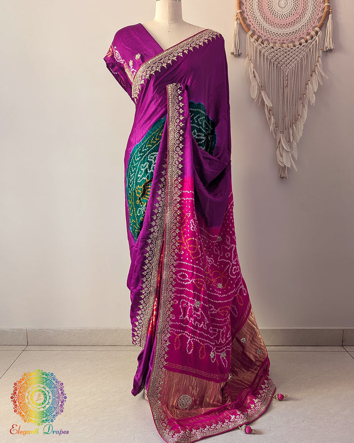Pink palla on magenta gaji silk saree highlighting multicolored Rasmandal motifs