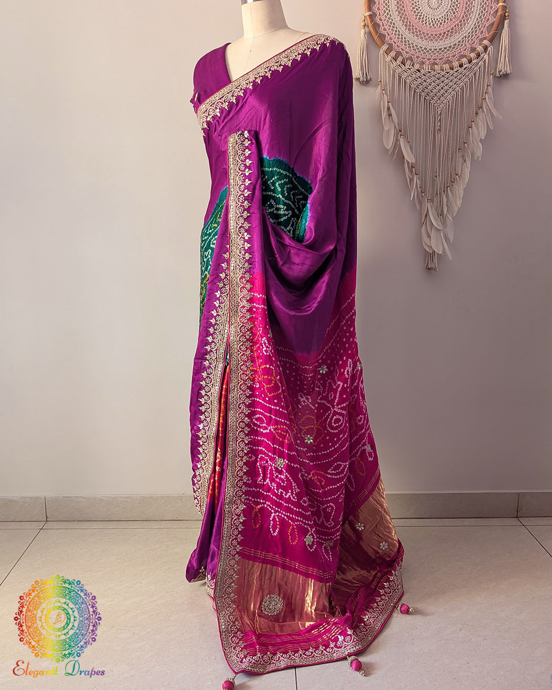 Side angle view of magenta gaji silk Rasmandal saree showcasing elegant silk drape