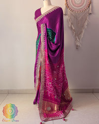 Side angle view of magenta gaji silk Rasmandal saree showcasing elegant silk drape