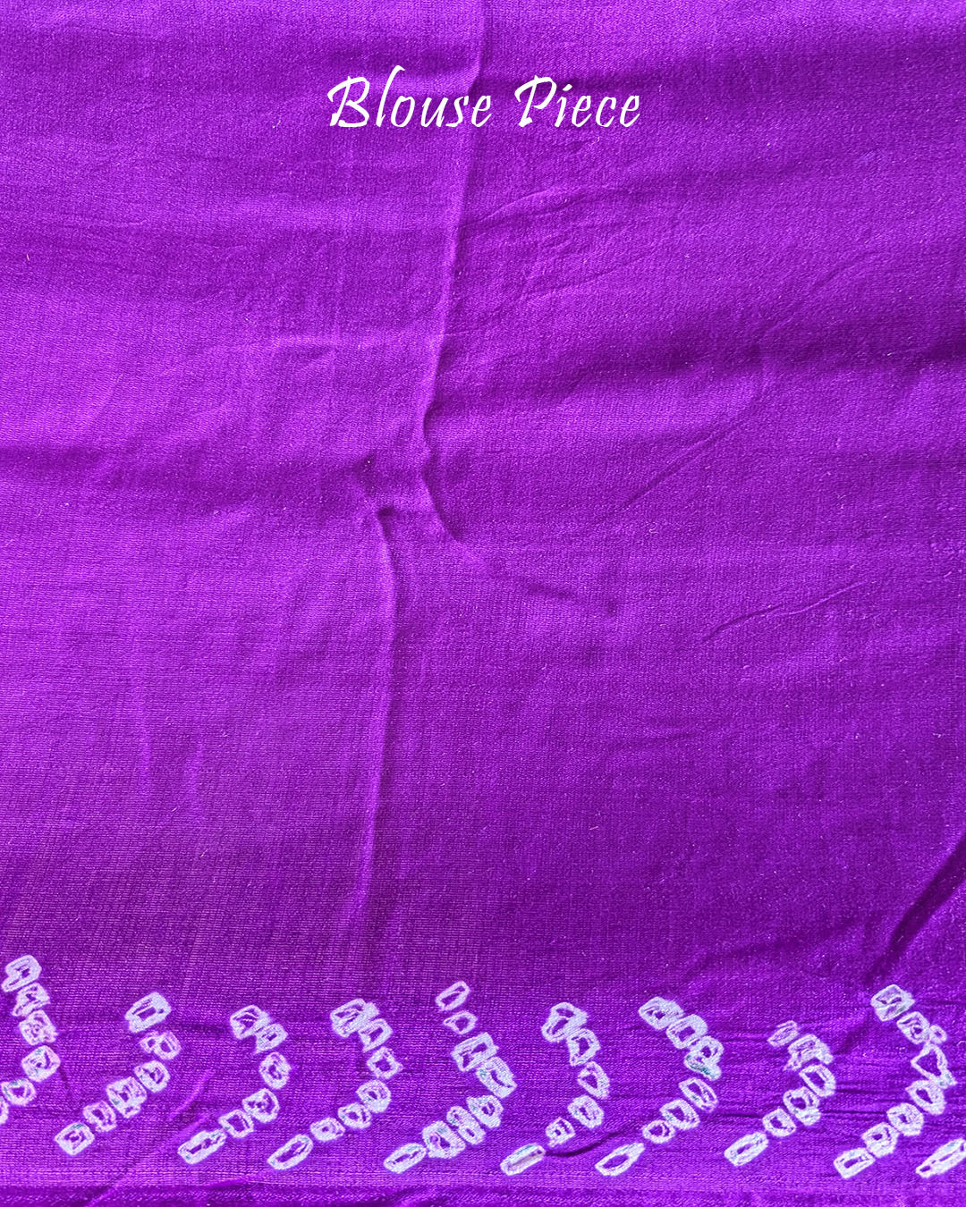 Matching blouse piece in purple gaji silk fabric with bandhani detailing