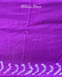 Matching blouse piece in purple gaji silk fabric with bandhani detailing