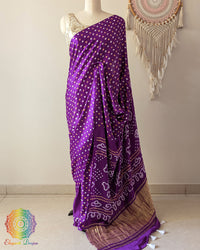 Purple pure gaji silk saree with all-over bandhani dots on mannequin showing full drape