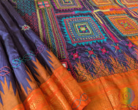 Orange border close up on blue Ilkal silk saree highlighting embroidery