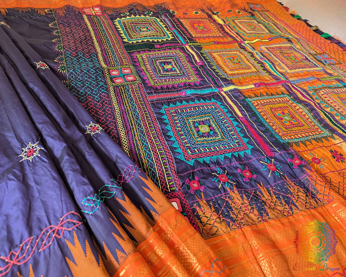 Traditional embroidered motif detail on blue Ilkal silk saree