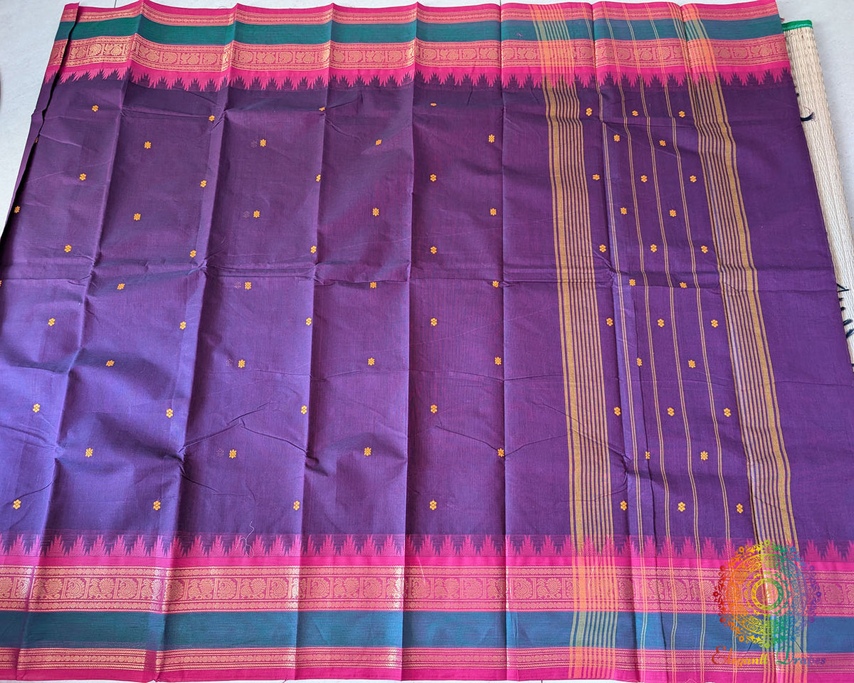 Full purple Kanchi cotton saree laid flat showing contrast pink border and design