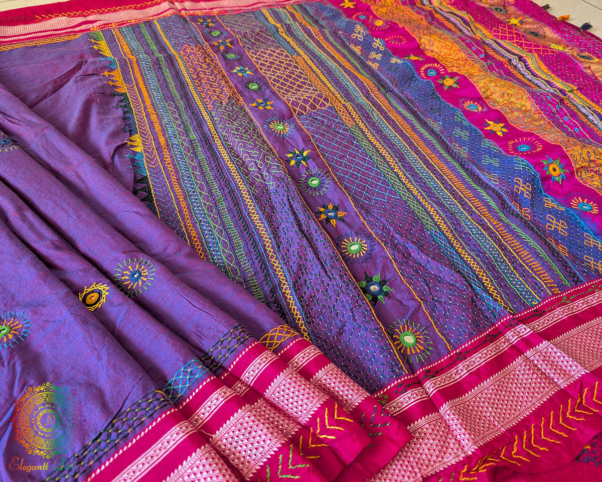 Close-up of intricate Lambani hand embroidery on the heavily embellished palla