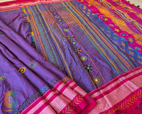 Close-up of intricate Lambani hand embroidery on the heavily embellished palla