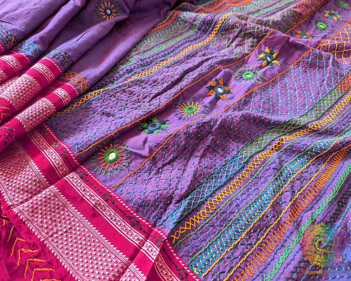 Purple Ilkal cotton saree highlighting traditional Lambani embroidery and handcrafted bootas