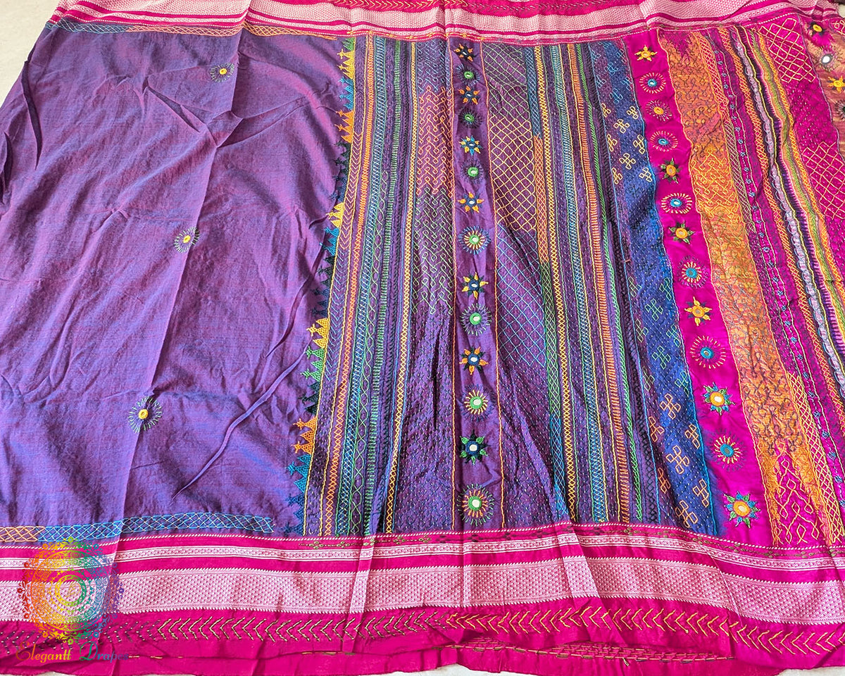 Detailed view of handcrafted Lambani embroidery on the purple Ilkal cotton saree