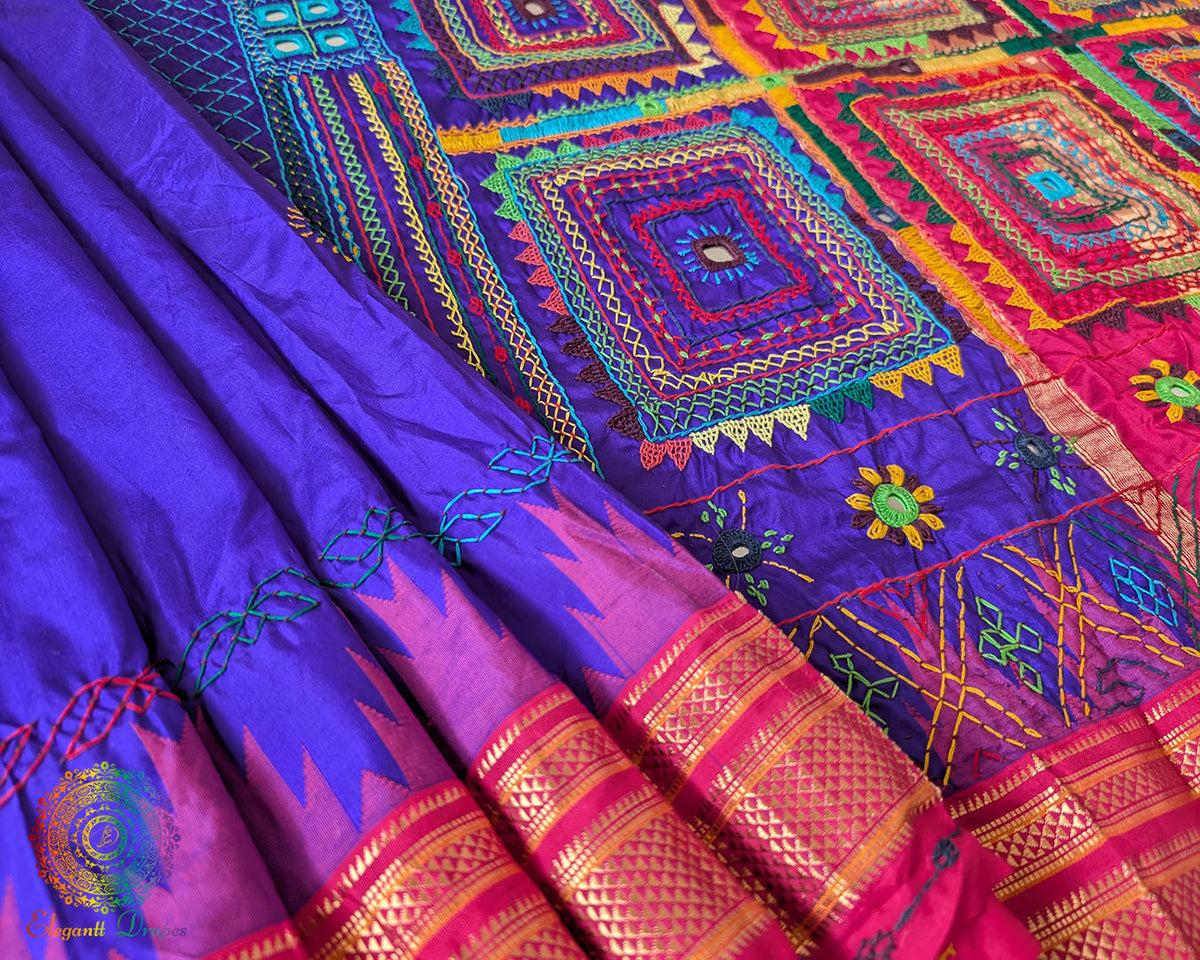 Purple Pure Ilkal Silk Saree shown in a detailed fabric view, highlighting the purple silk texture and intricate Lambani embroidery.