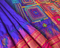 Purple Pure Ilkal Silk Saree shown in a detailed fabric view, highlighting the purple silk texture and intricate Lambani embroidery.