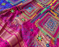 Close-up of the Purple Pure Ilkal Silk Saree showcasing intricate Lambani hand embroidery, with colourful threadwork and traditional handcrafted patterns.