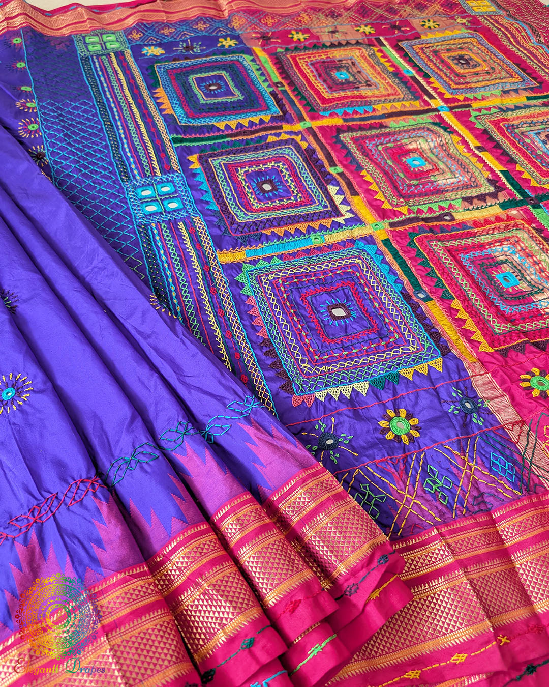 Purple Pure Ilkal Silk Saree with Lambani Hand Embroidery shown in a full open view, highlighting the rich purple silk body and colourful traditional handwork.