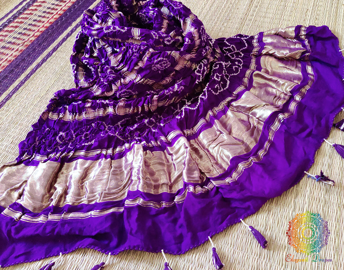 Intricate Gold Zari Palav and hand-crafted Bandhani work on a luxurious Purple Gaji Silk Dupatta.