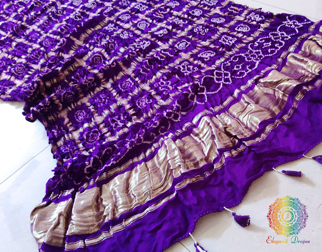 Detailed view of the Gharchola grid pattern and gold Zari border on a Purple Pure Gaji Silk Bandhani Dupatta.