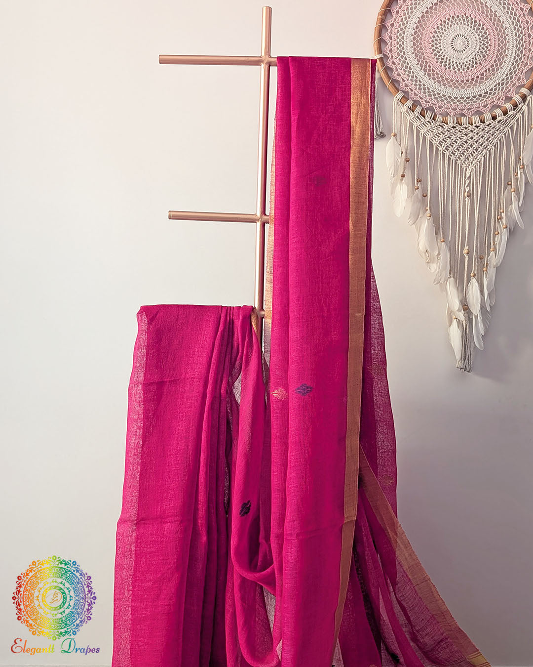 Rani pink linen saree body close up highlighting natural fabric texture