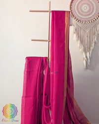 Rani pink linen saree body close up highlighting natural fabric texture