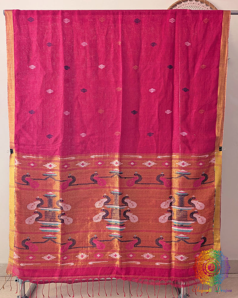 Full rani pink linen saree laid open showing overall design and layout