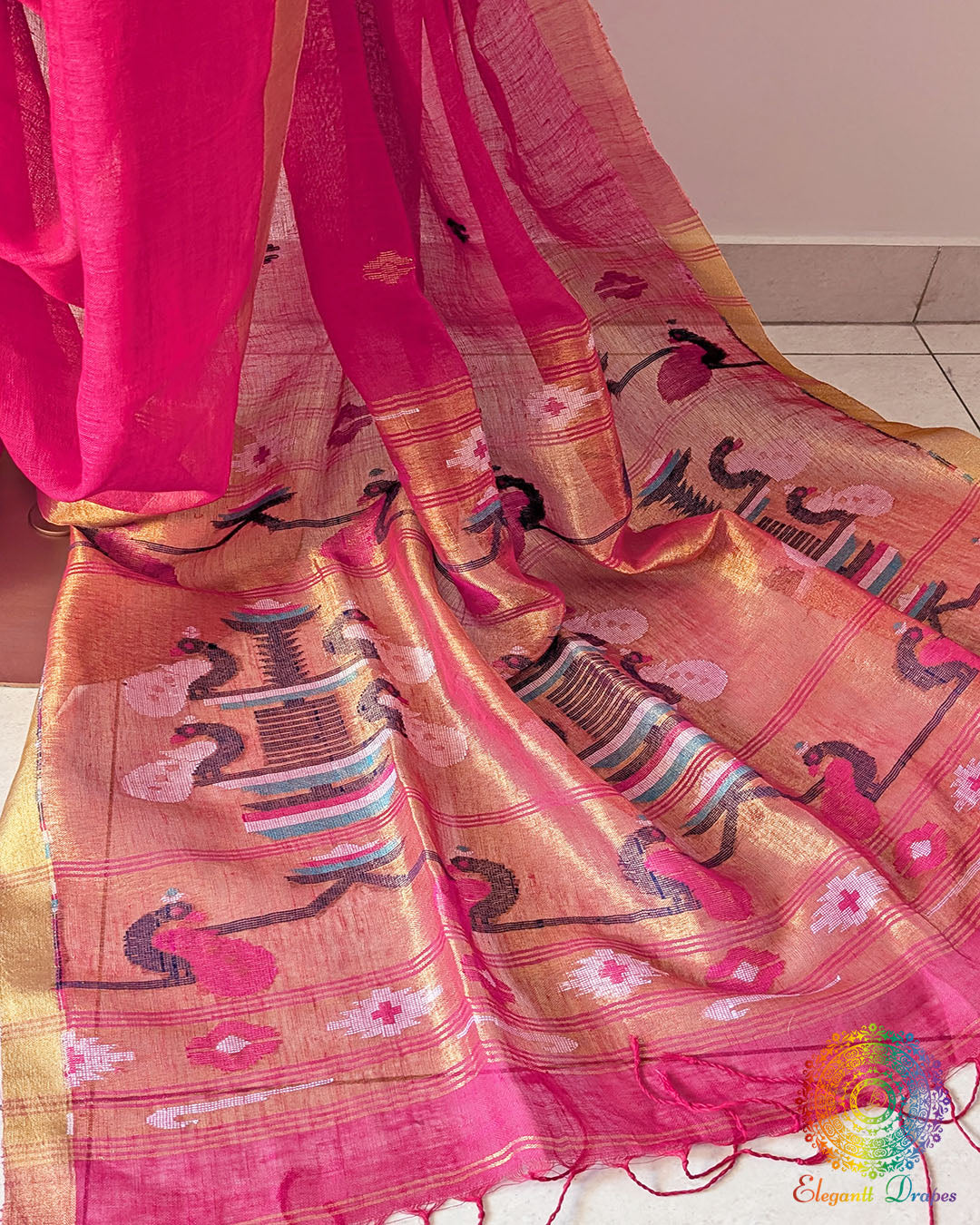 Paithani palla close up on rani pink linen saree highlighting motifs