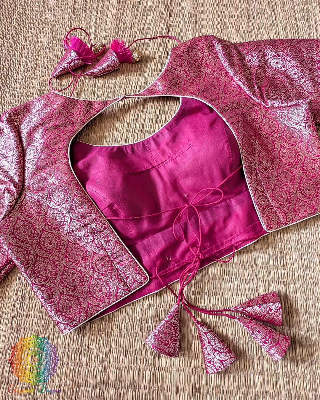 Double dori back tie-up with matching brocade tassels on the Rani Pink Designer Blouse