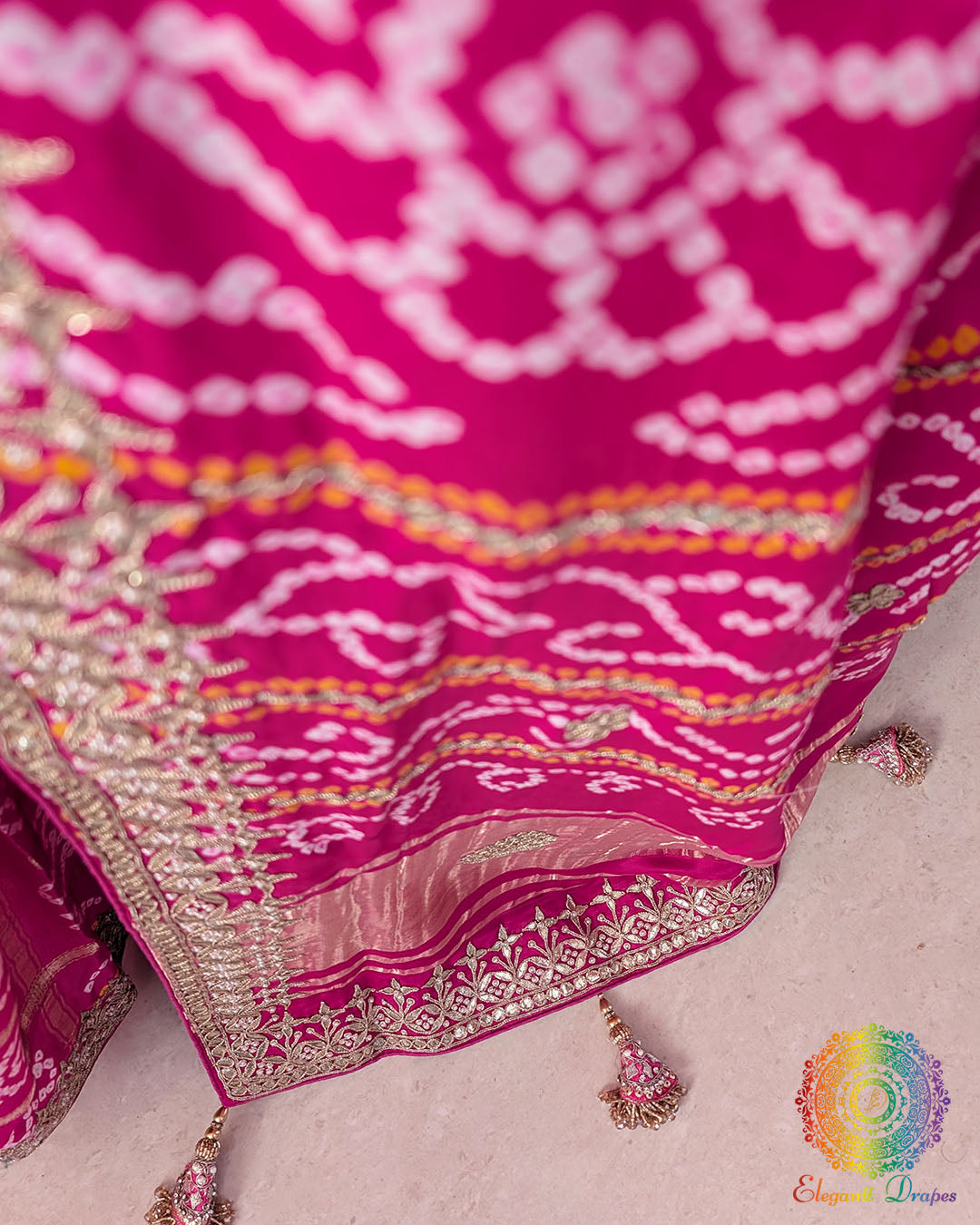 Close-up of intricate Gota Patti handwork on the pallu of the Magenta Pink Gharchola Saree