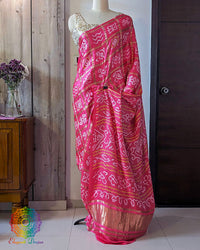 Magenta Gharchola gaji silk bandhani saree on mannequin showing full drape and silhouette